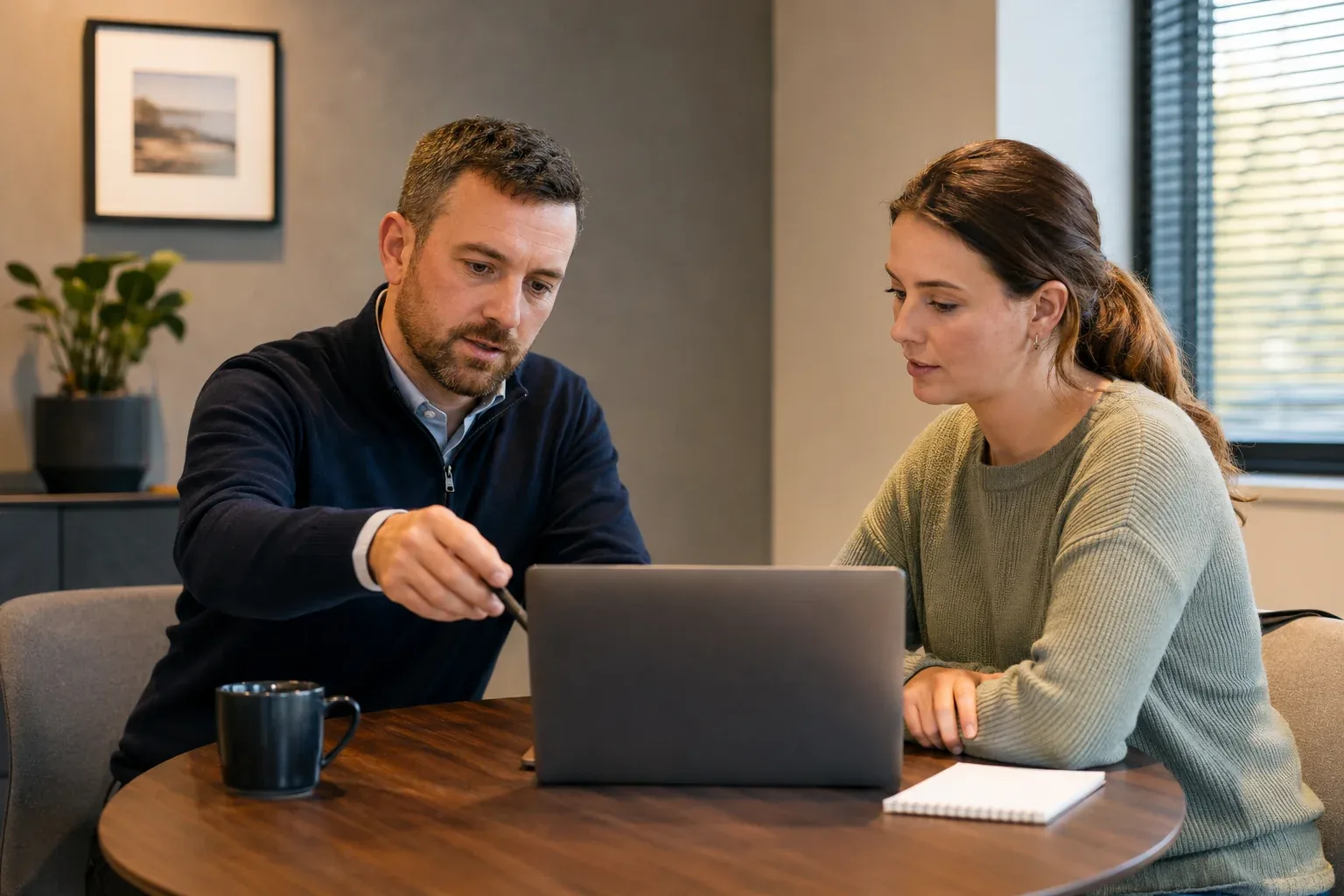 Two people going through a website plan together