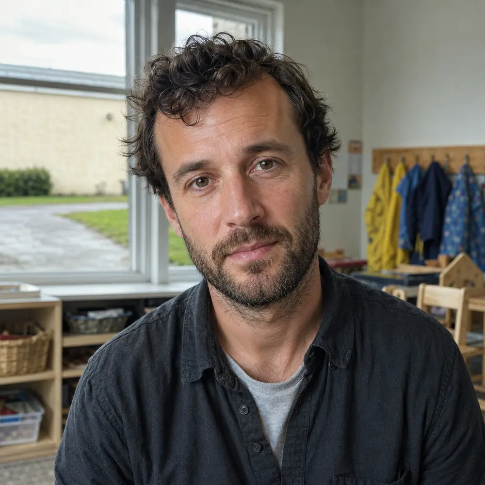 A childcare professional standing in their childcare setting